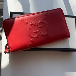 Gucci Lion Embossed GG Zip Around Leather Wallet